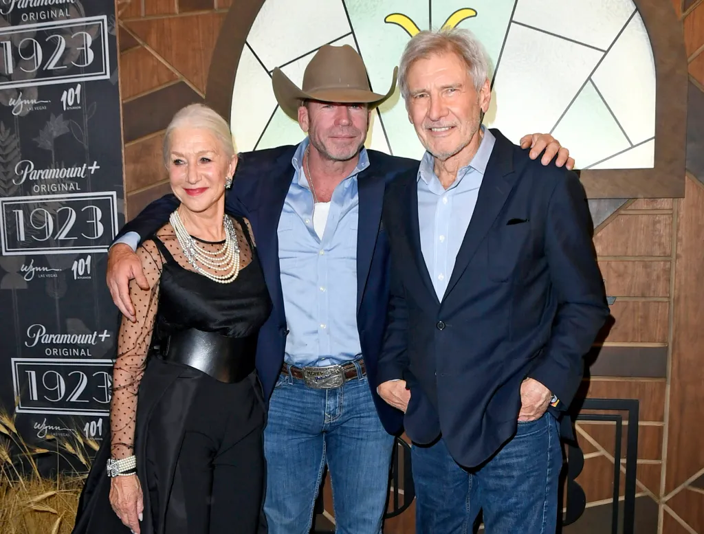 Helen Mirren, in a black dress with black belt, Taylor Sheridan, in a cowboy hat, blue blazer, blue shirt and blue jeans, and Harrison Ford, in a blue blazer, blue shirt and blue jeans, at Paramount+'s 