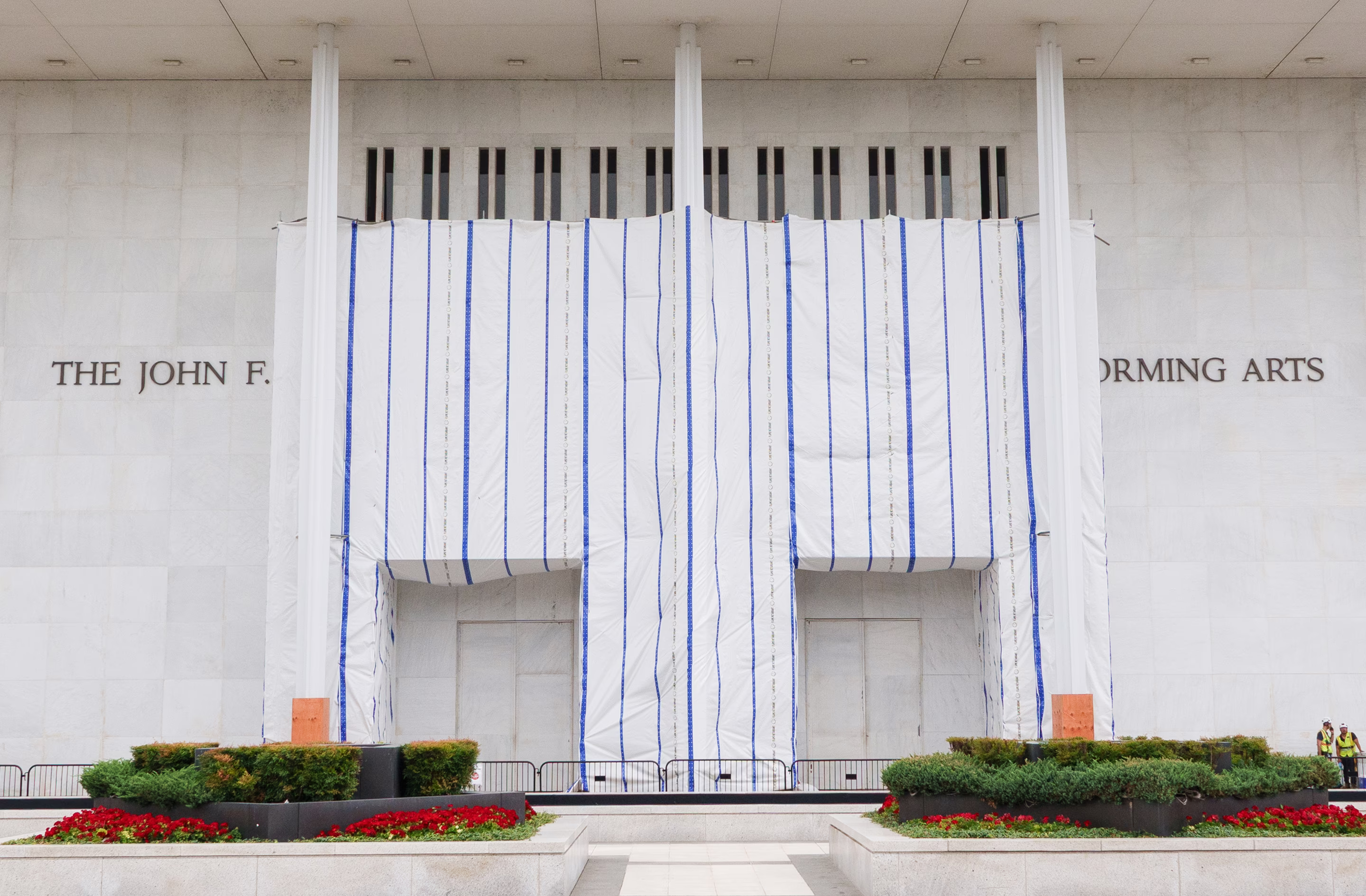 construction tarps hang out front of the Kennedy Center