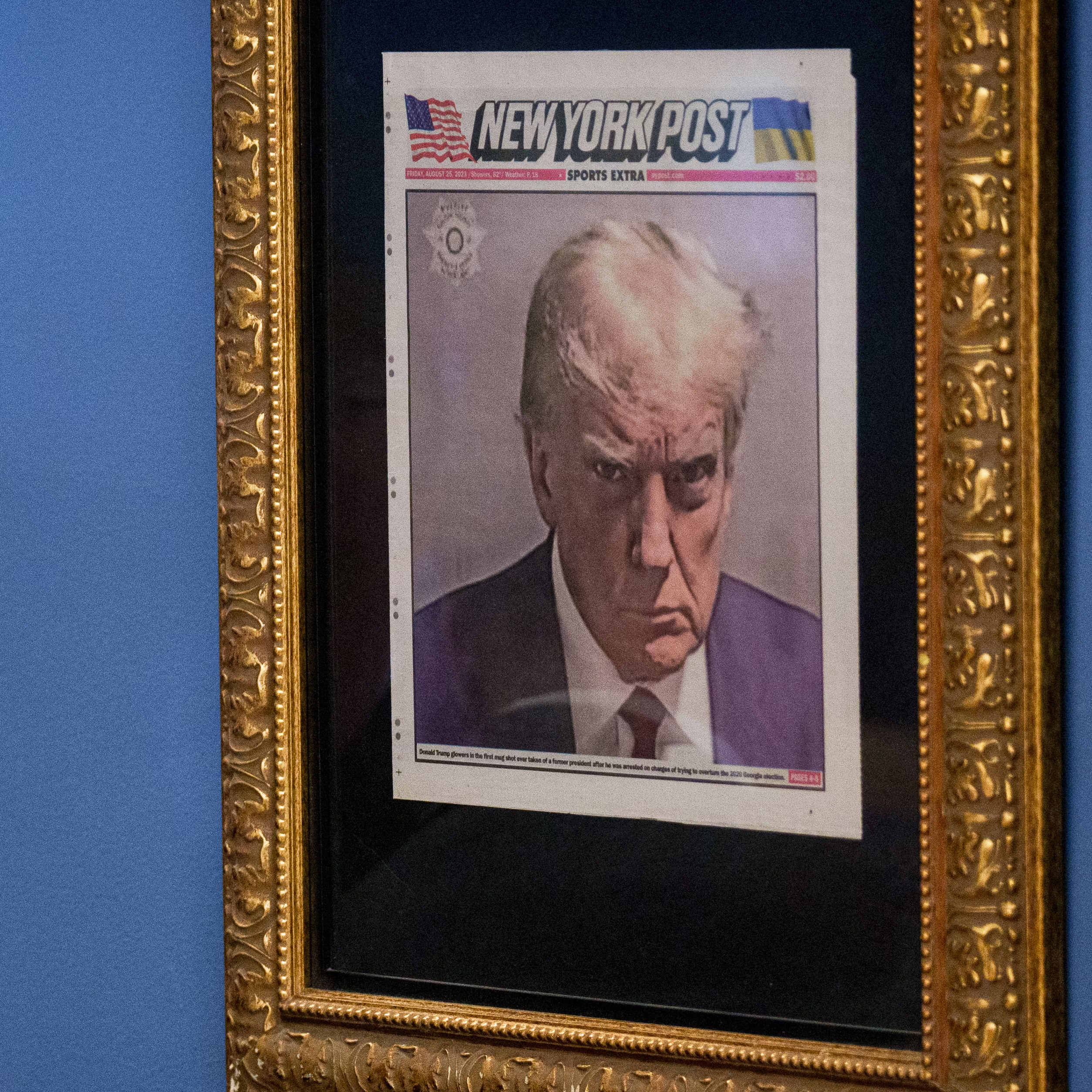 U.S. President Donald Trump's mugshot on the front of the New York Post is framed in an office just outside the Oval Office 