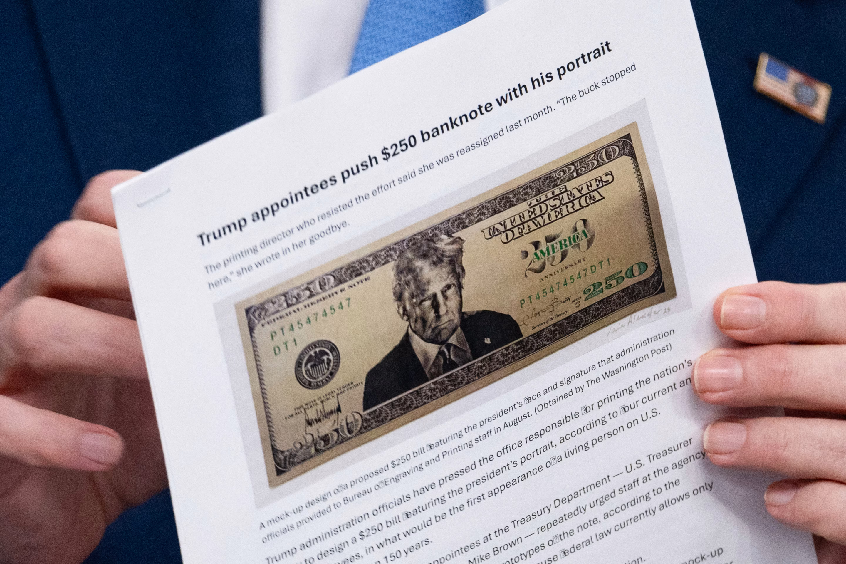 a printed paper with a drawing of a $250 Donald Trump bill