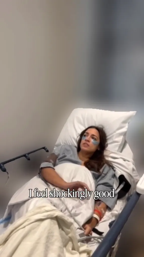 Alexandria Ocasio-Cortez lies in a hospital bed with eye masks on, saying, 