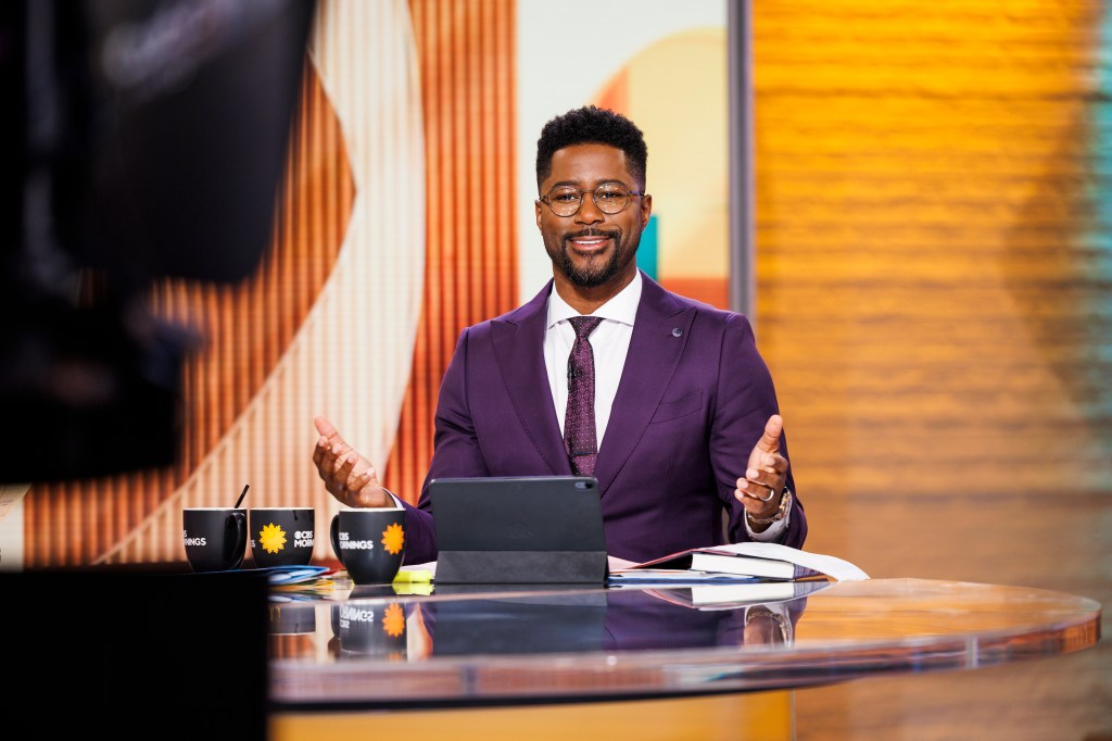 Nate Burleson, co-host of CBS Mornings, sits at a desk in the CBS Broadcast Center.