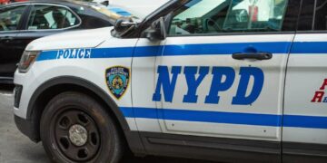 BMW driver smashes, flips NYPD cruiser — and injures 2 cops, video shows