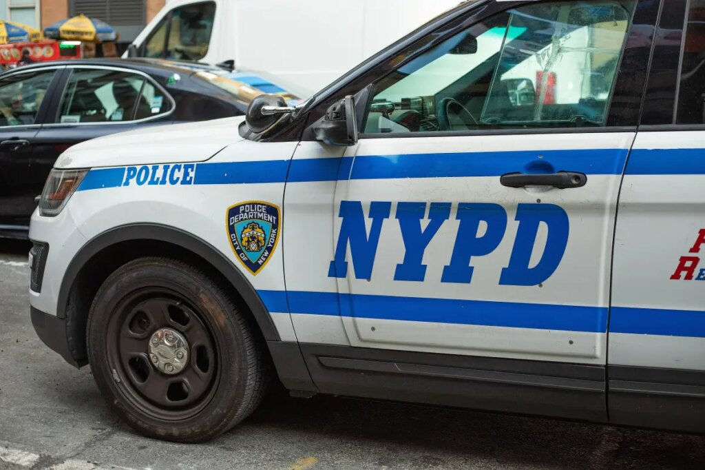 BMW driver smashes, flips NYPD cruiser — and injures 2 cops, video shows
