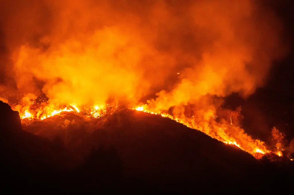 Wildfire burning on a hillside in Big Sur, California.