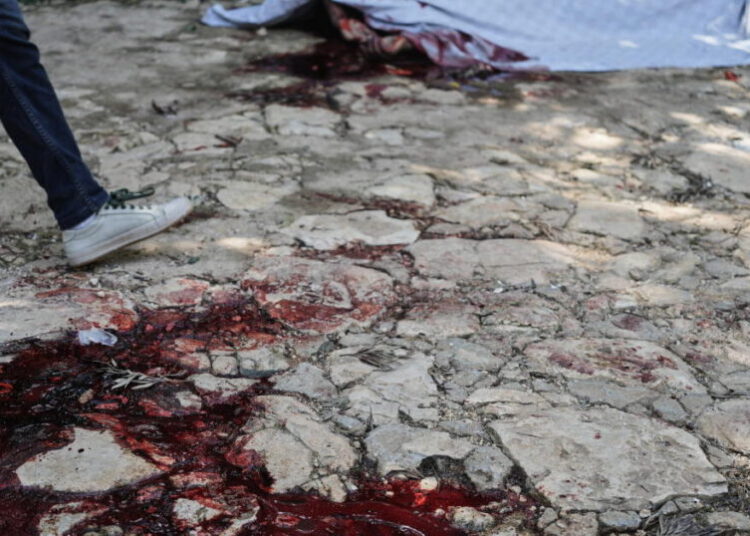 Hundreds attend funeral in Haiti for 4 victims of brutal gang attack that killed 47