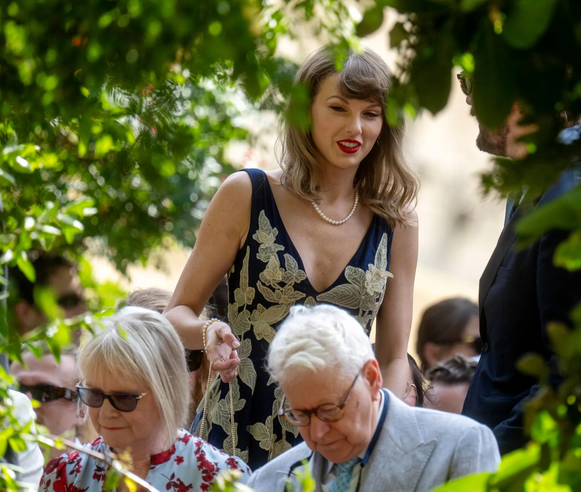 Taylor Swift at the wedding of recording engineers Oli Jacobs and Laura Sisk.