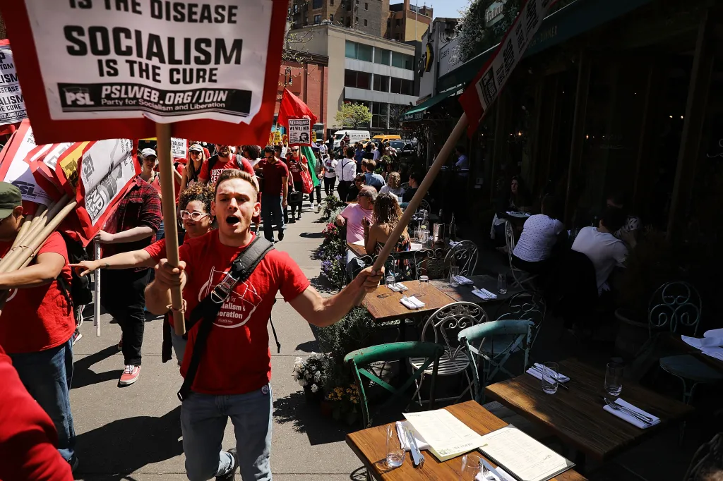 Dozens of people march in May Day protests on Tuesday, May 1, 2018, in New York City.
