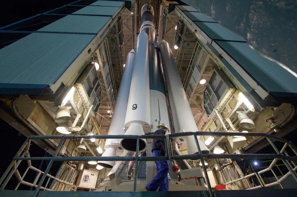 A worker preparing the ULA Delta II rocket, with the NASA ICESat-2 onboard, for launch.