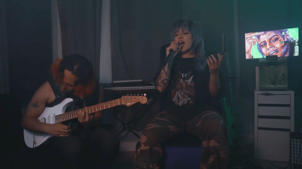 Bad Wolves guitarist AJ Robello and singer Killboy performing a cover of 