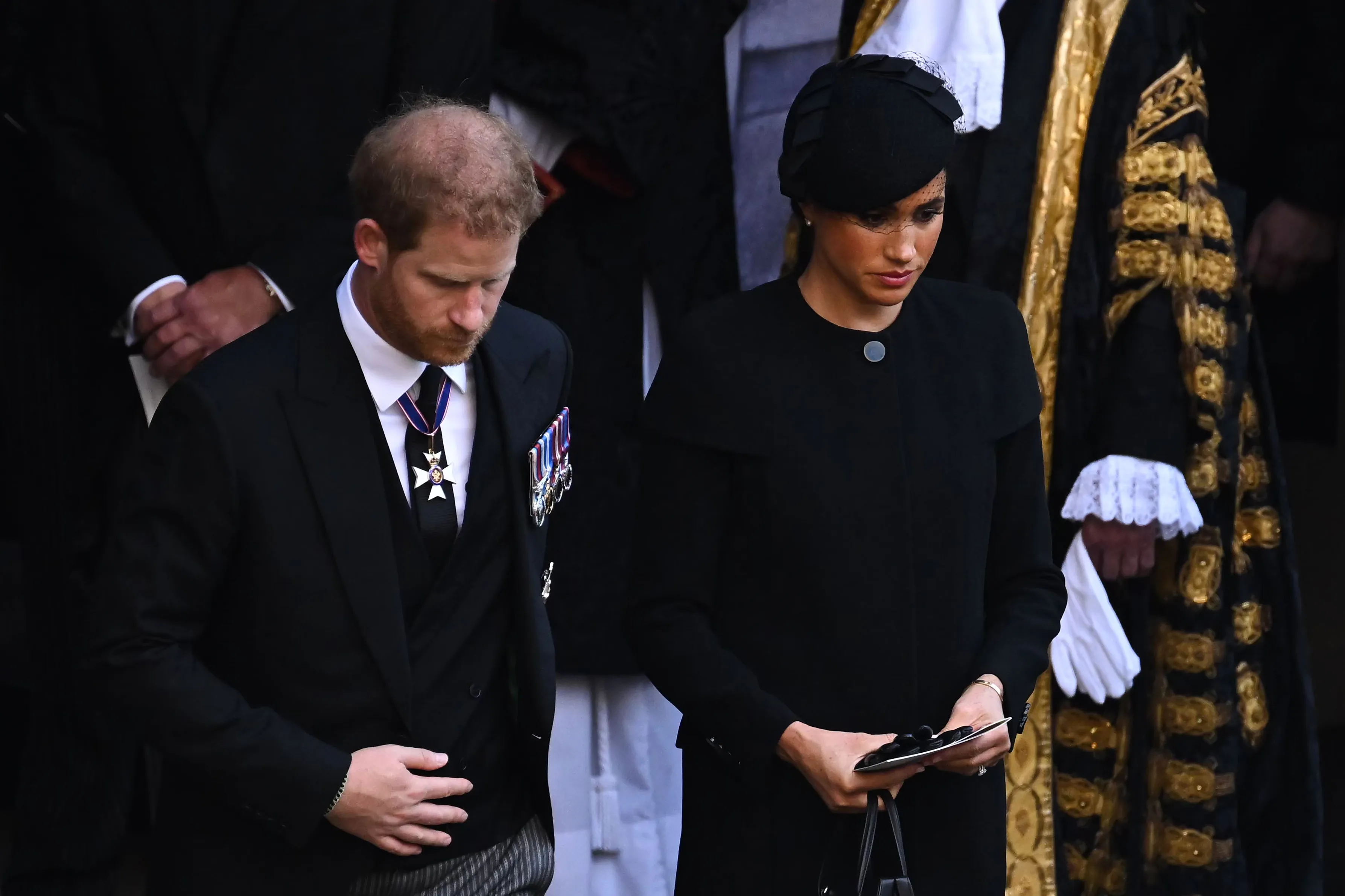 Prince Harry and Meghan Markle at a service for Queen Elizabeth II's coffin.