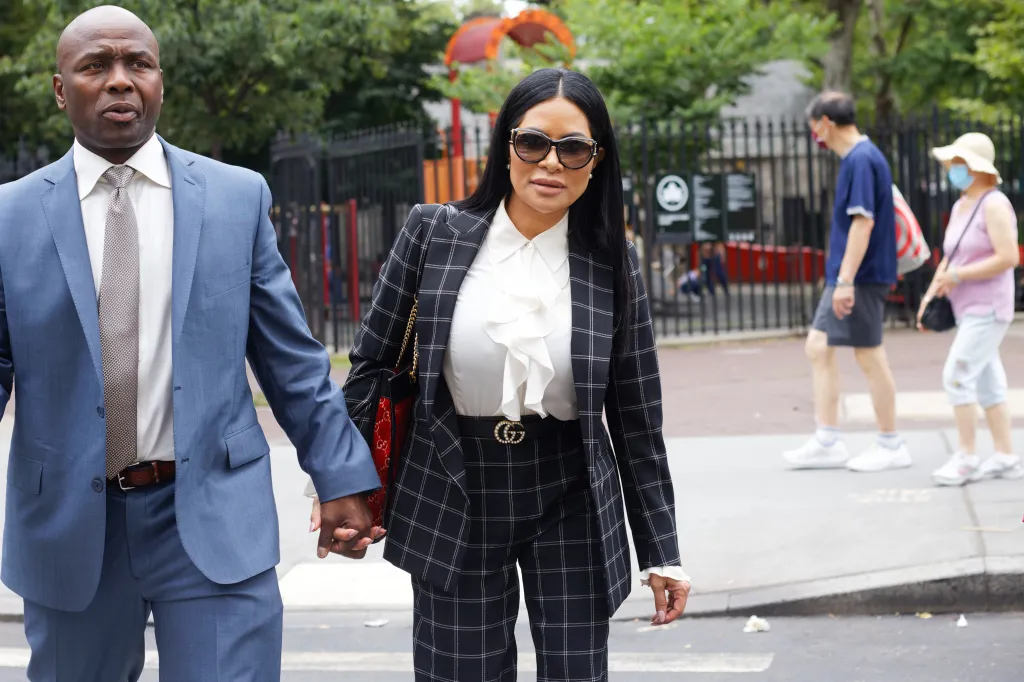 Jen Shah arrives at the Daniel Patrick Moynihan United States Courthouse holding hands with a man in a blue suit.