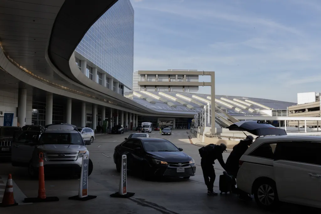 Travelers arriving at Dallas-Fort Worth International Airport.