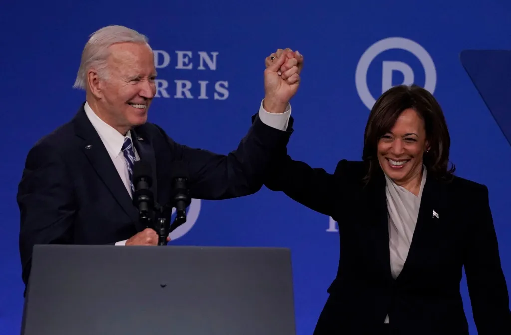 President Joe Biden raises Kamala Harris' hand at the Democratic National Committee Winter meeting in Philadelphia, Penn., on Feb. 3, 2023.