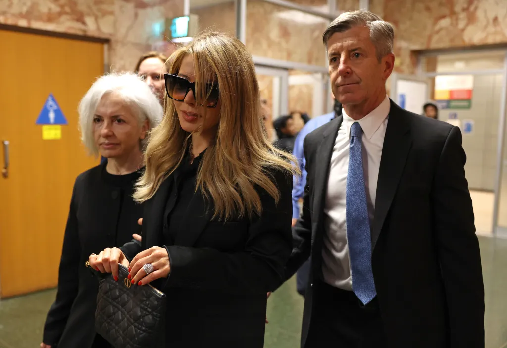 Khazar Elyassnia arrives for her brother Nima Momeni's arraignment in San Francisco.