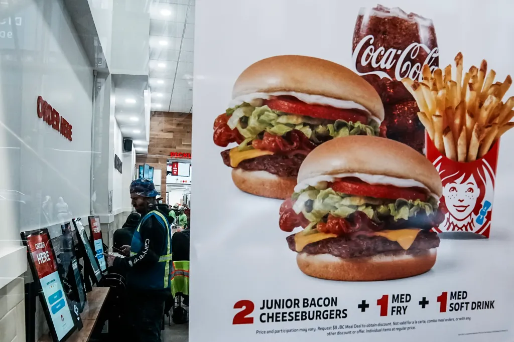 Two Wendy's double cheeseburgers on a sign