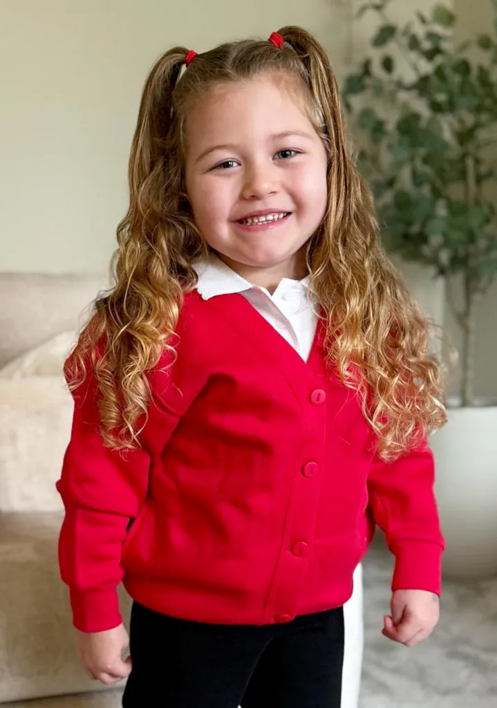 Olivia Elliot, who suffered a stroke, smiles at the camera.