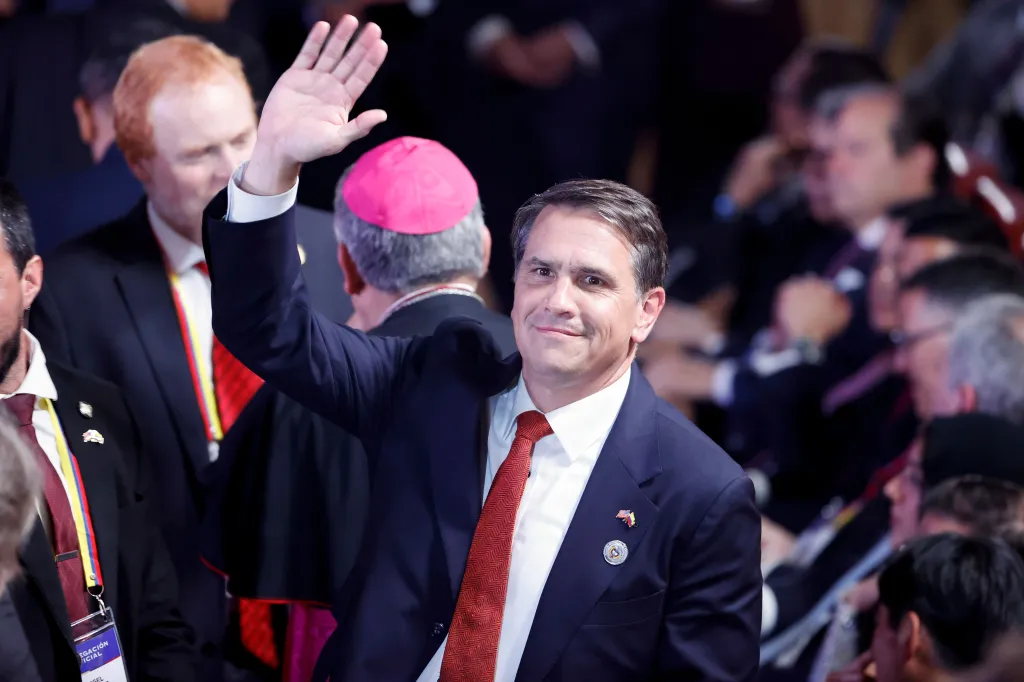 Acting US Attorney General Todd Blanche waves during Abelardo de la Espriella's presidential inauguration.