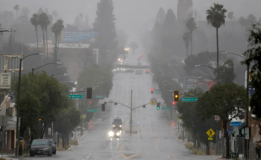 Motorists drive through rainfall in Altadena, California.