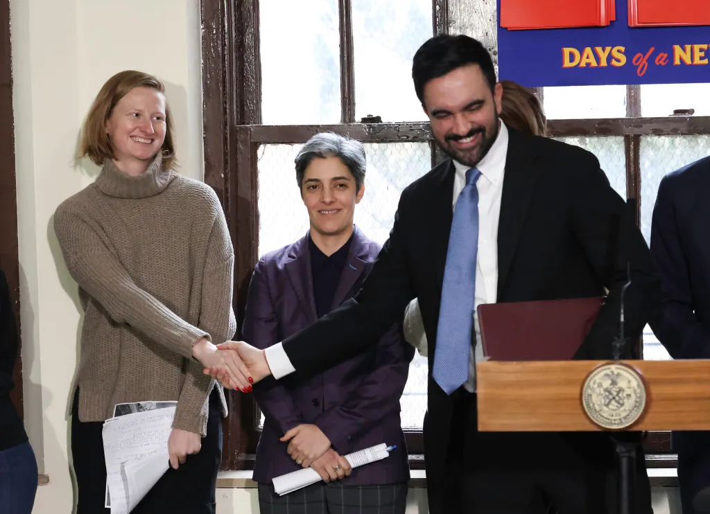 NYC Mayor Zohran Mamdani shakes hands with Housing Czar Cea Weaver at a press conference.