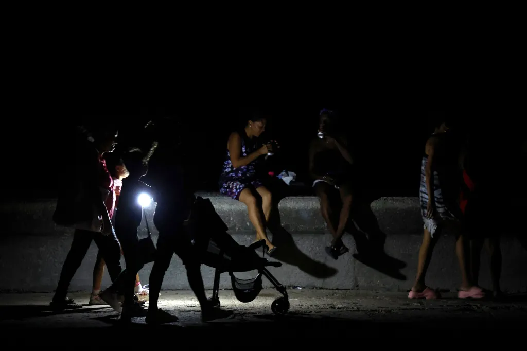People walk during a power outage in Havana, Cuba, Aug. 1, 2026.