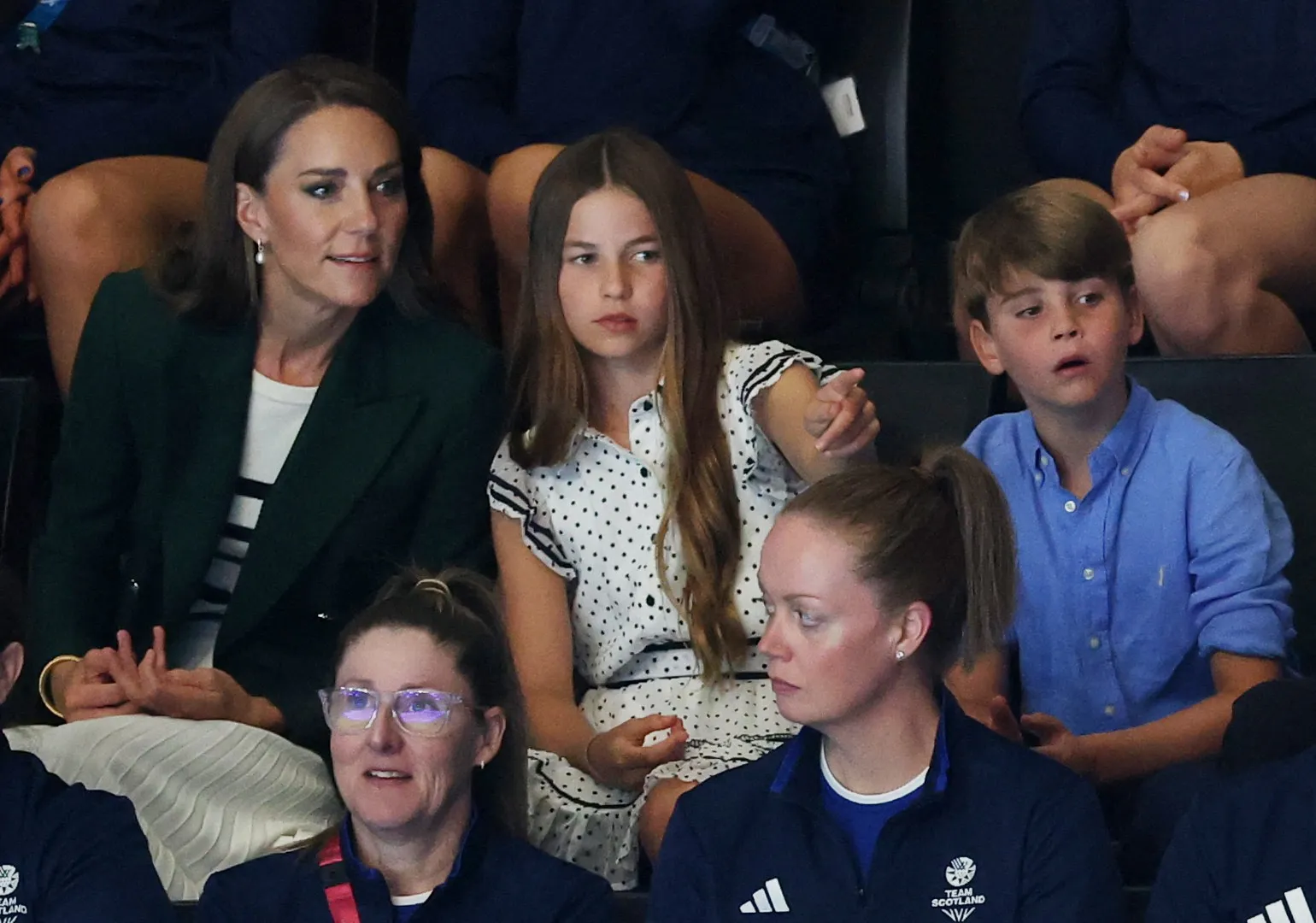 Catherine, Princess of Wales, Princess Charlotte, and Prince Louis in the stands at the Netball semi-final between Australia and Jamaica at the Commonwealth Games 2026.