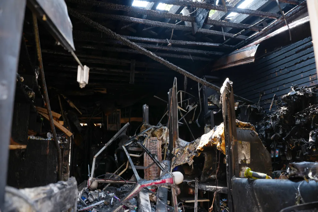 Fire damage is seen inside a deli at 4 W. 183rd St. on Wednesday, August 12, 2026, in the Bronx, N.Y. A man was rushed to the hospital with serious burn injuries after a two-alarm fire broke out Tuesday night and spread to multiple businesses. 