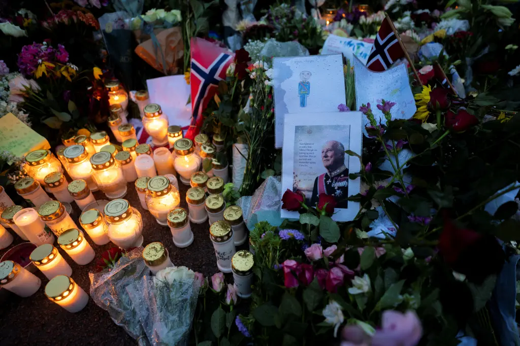 Flowers and candles honoring the late King Harald V of Norway are placed at the Palace Square in Oslo.