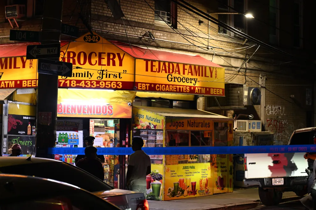 NYPD officers at the scene of a double shooting outside Tejada Family Grocery in Queens, New York.