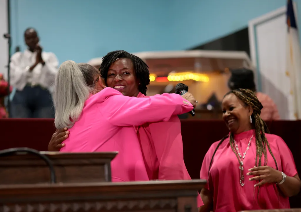 Democratic Senate candidate and Florida state Rep. Angie Nixon is embraced by worshippers at Ebenezer Missionary Baptist Church on Aug. 17, 2026.