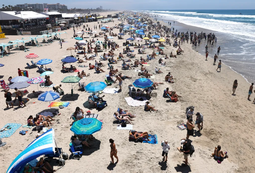 Crowds gather on Huntington Beach during the US Open of Surfing.