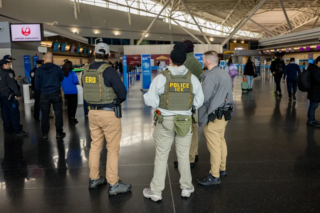 ICE agents patrol Terminal 8 at John F. Kennedy International Airport.