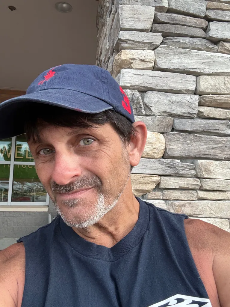 Daryl Alexander Hill, a 56-year-old man, poses for a selfie.