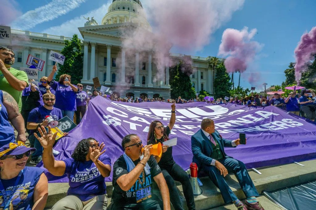 Anica Walls and other SEIU Local 1000 members rally outside the Capitol Building against Governor Newsom's return-to-office policy.