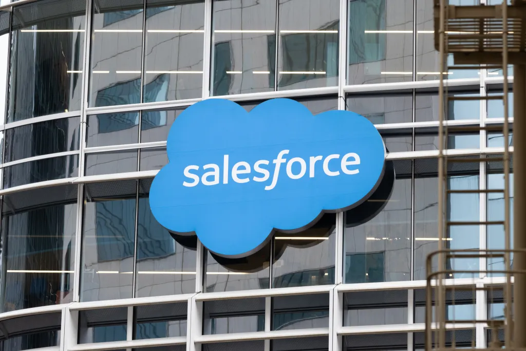 A blue Salesforce cloud logo on the side of an office building.