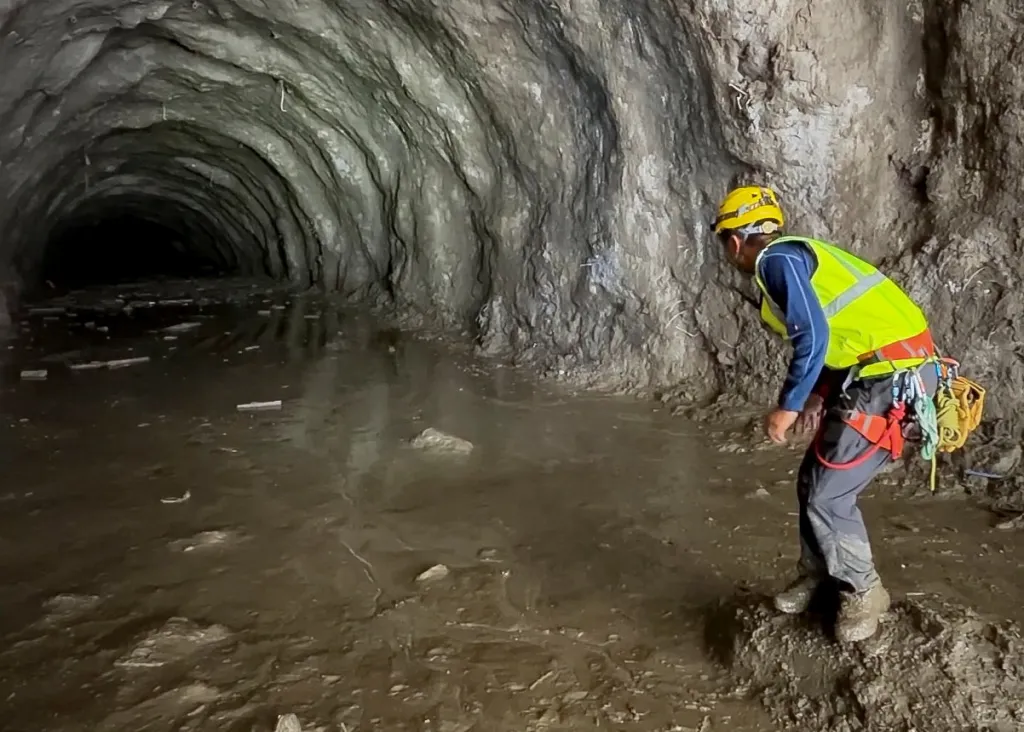 A rescuer works at the entrance of a tunnel at Chilime Hydropower Plant during rescue operations for people trapped inside following deadly flash floods and a mudslide in Rasuwa, Nepal, on Aug. 31, 2026.