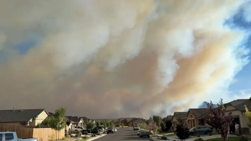 Smoke from the Hawk Fire blankets the sky over a residential neighborhood in Reno, Nevada, on Aug. 22, 2026.