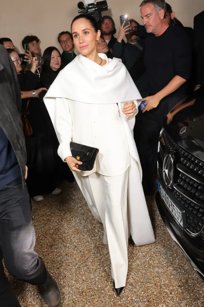 Meghan Markle in a cream outfit attending the Balenciaga show at Paris Fashion Week.