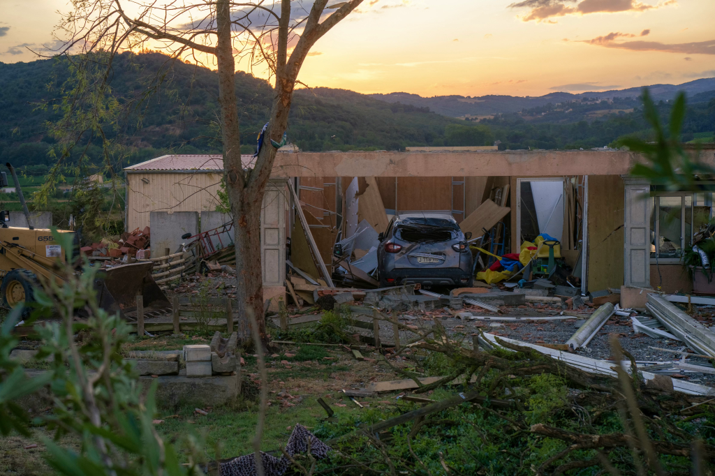 Damaged houses and a car in Pomas, France after a tornado.