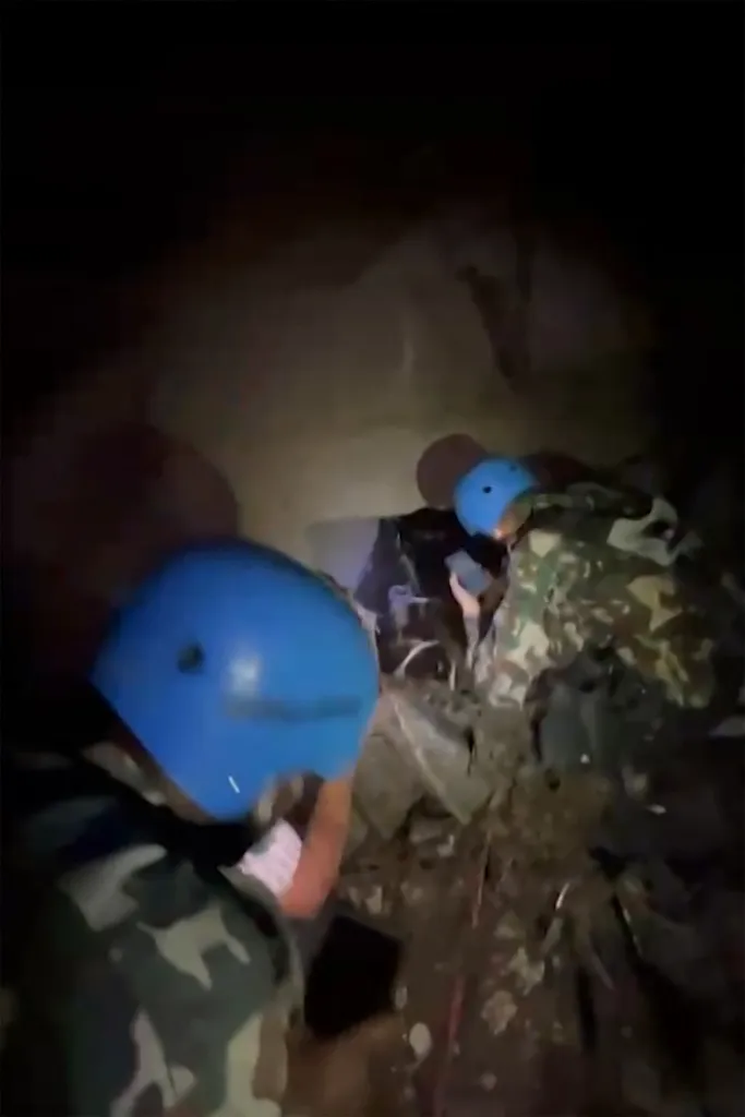  Nepali soldiers inside a tunnel amid rescue operations to free workers believed to be trapped at the scene of the Langtang hydropower project in Nepal's Rasuwa district. 