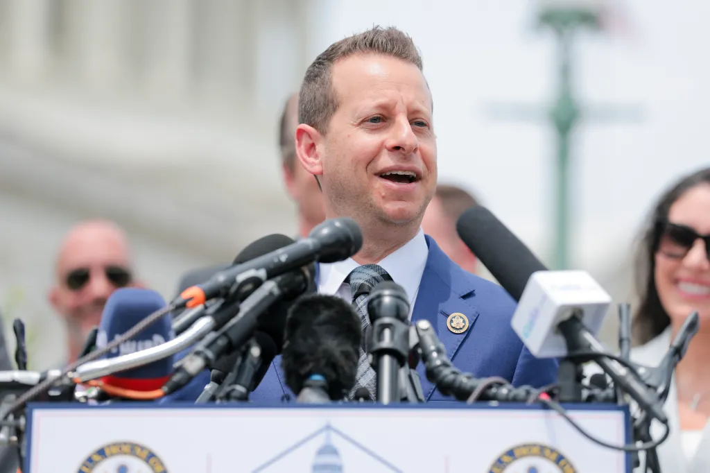 Rep. Jared Moskowitz speaking at a news conference on UAPs outside the U.S. Capitol Building.