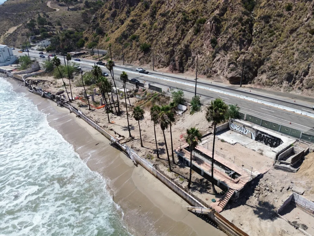 Aerial view of destroyed structures on the beach at 20940 Pacific Coast Highway in Malibu after the 2025 LA wildfires.