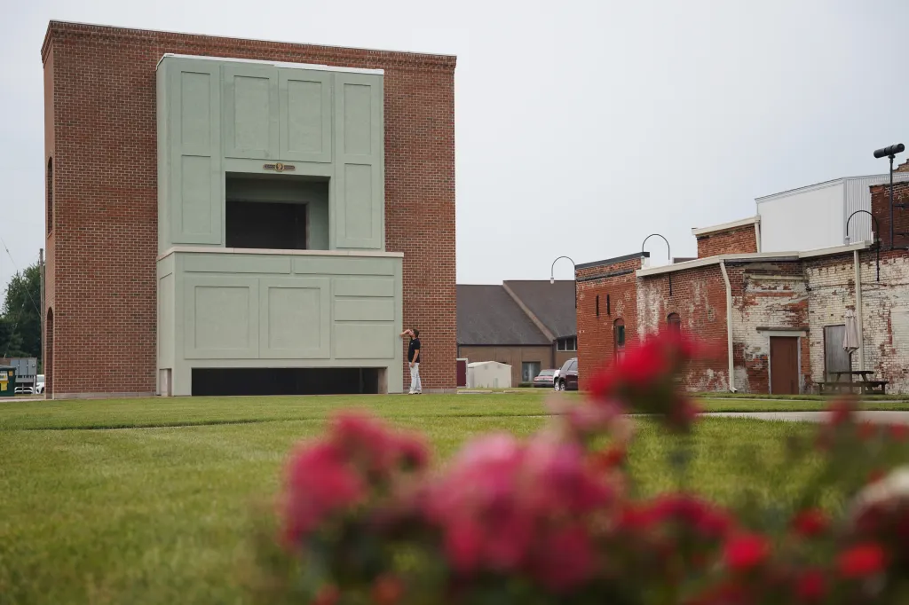 Dubbed the world’s largest Hoosier cabinet, the replica built against a brick background is equipped with stairs leading to a loft.