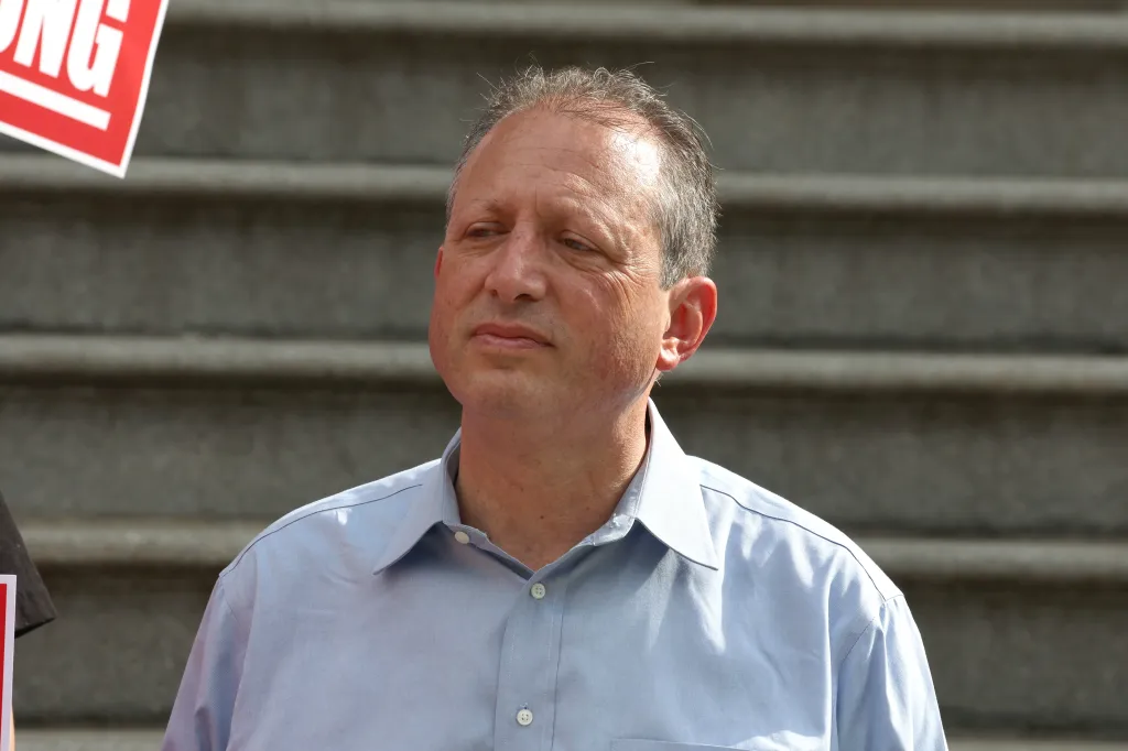 Former New York City Comptroller Brad Lander is pictured at a rally by Teleperformance call center workers.
