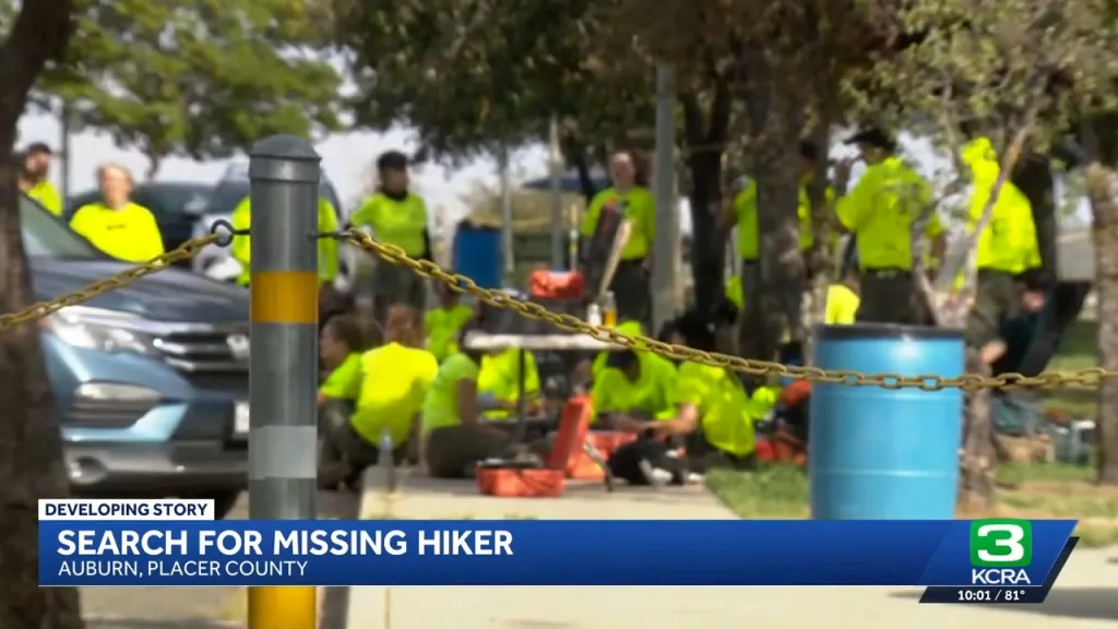 News report showing search and rescue teams in bright green shirts.