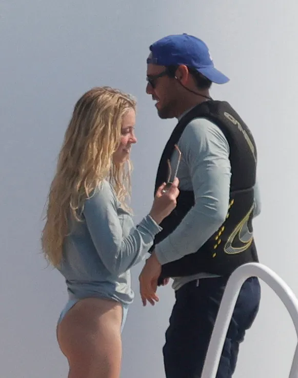 Sydney Sweeney and Scooter Braun talking on a yacht in Mallorca.
