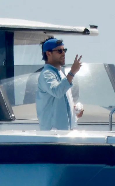 Scooter Braun giving a peace sign while on a boat in Mallorca.
