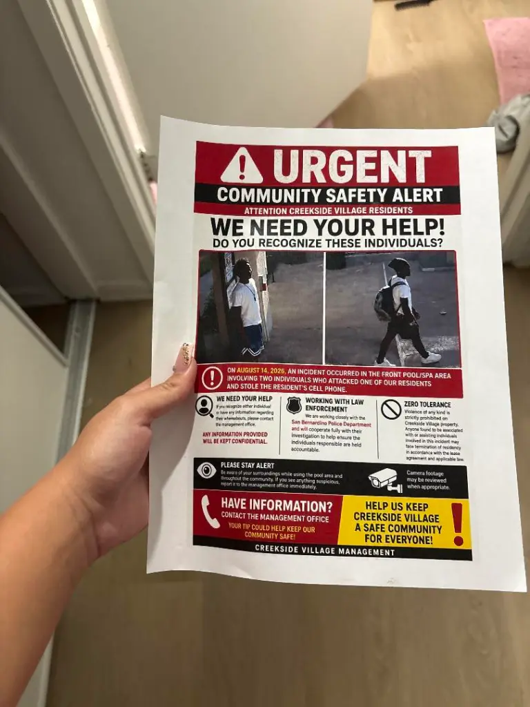 Community safety alert poster from Creekside Village Management with photos of two individuals wanted in connection with an August 14, 2026, incident involving an assault and stolen cell phone.