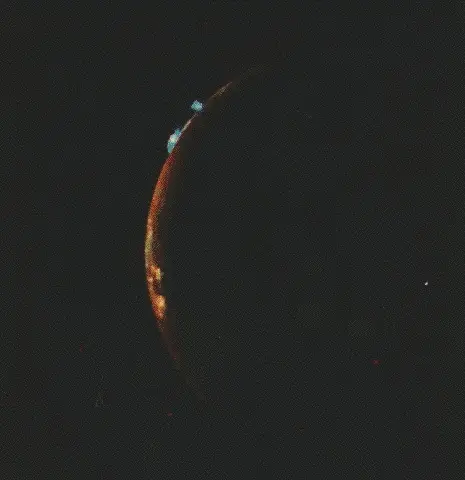Volcanic activity captured on the surface of Io, Jupiter's moon, by the Voyager probes.