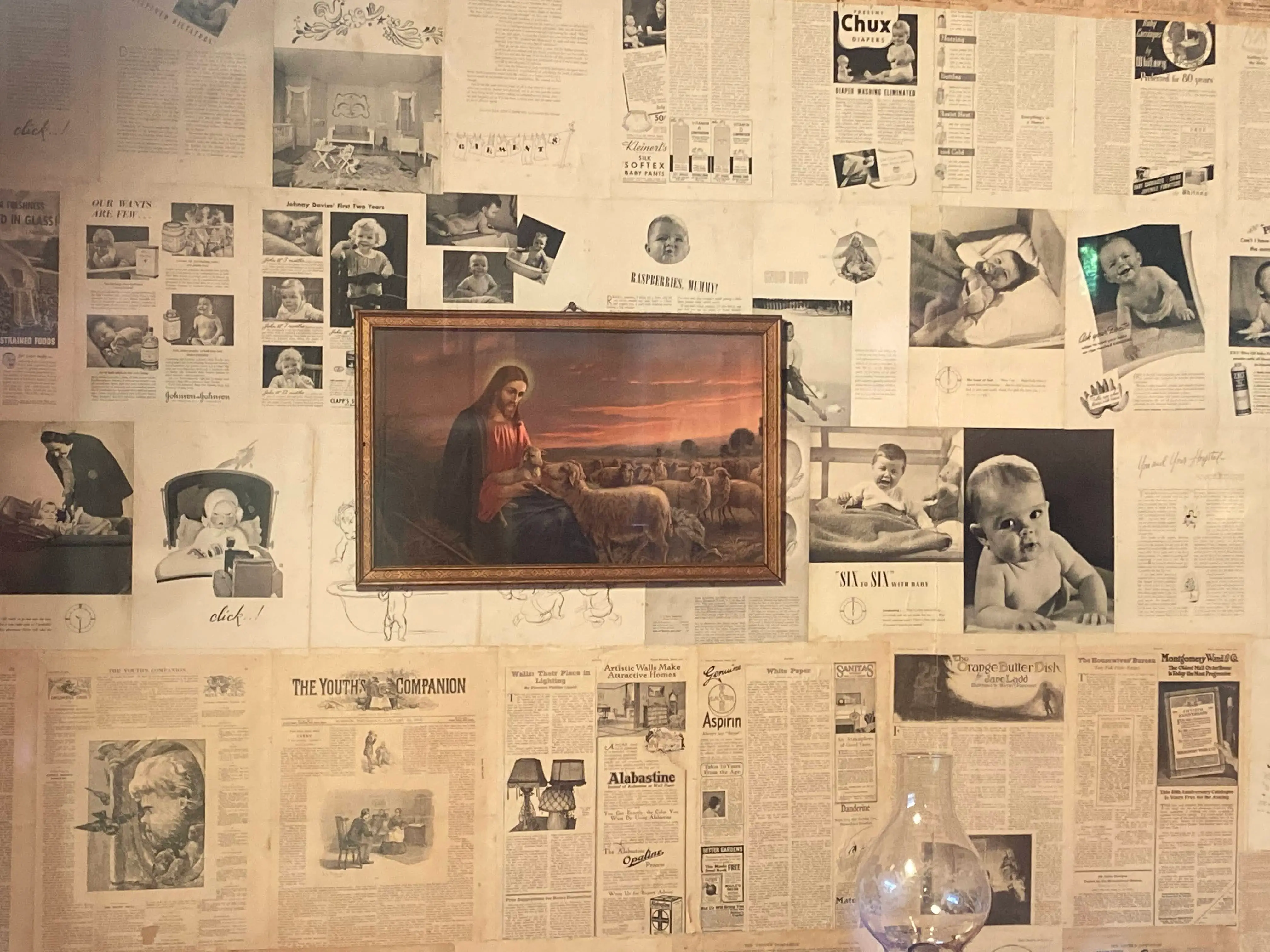 A photo of Jesus on the wall in a replica of Dolly Parton's childhood home at Dollywood.